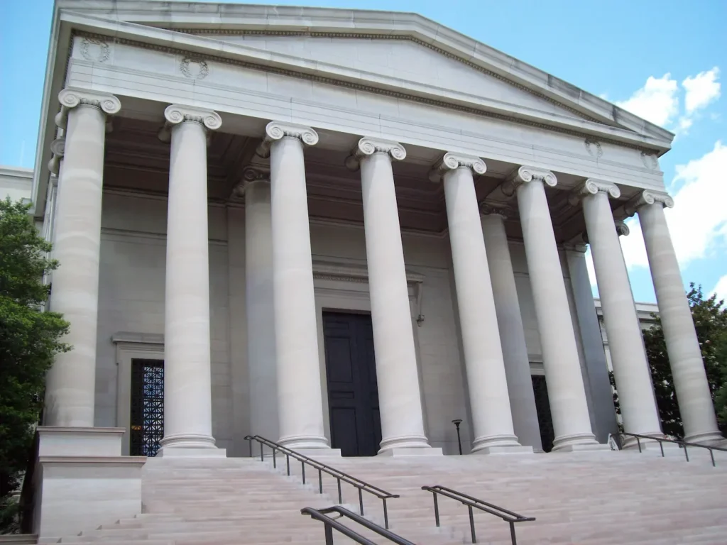 Courthouse building entrance with large columns supporting courthouse locksmith services for judicial buildings, courtrooms, judge chambers, and secured government facilities