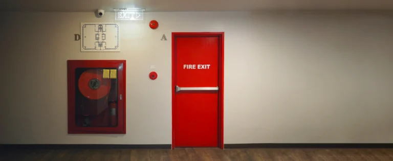 Fire rated exit door with panic bar installed in a commercial building for emergency safety and code compliance